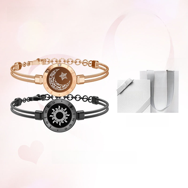 Two bracelets with sun and moon designs on a white background
