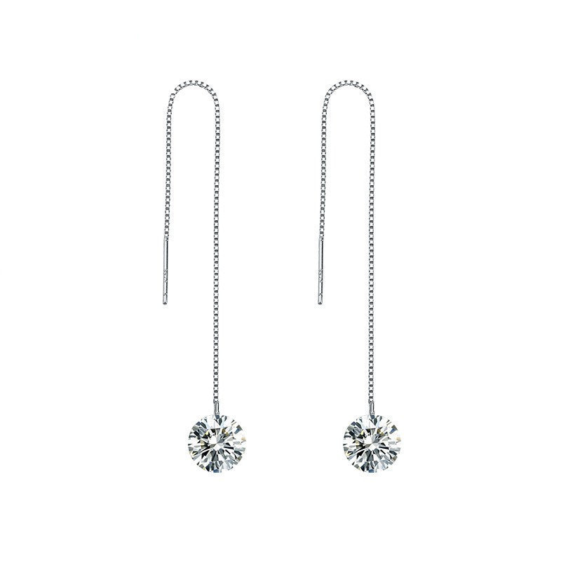 Pair of silver threader earrings with crystal drops on a white background