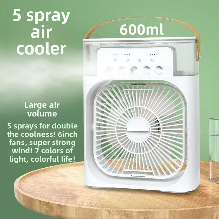 White portable air cooler with a clear water tank and handle, shown on a wooden table with promotional text overlays reading '5 spray air cooler' and '600ml'.
