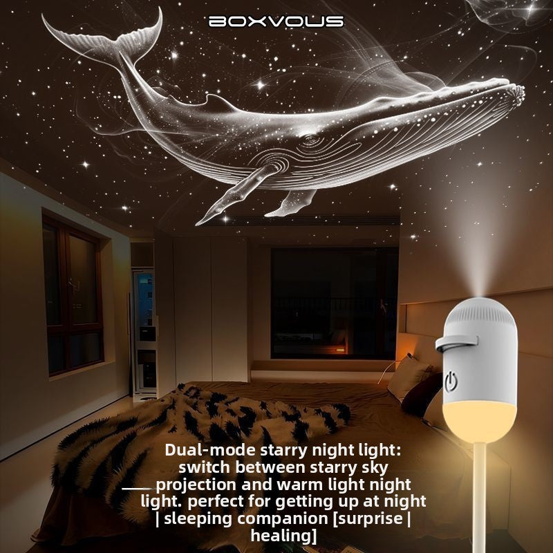 Starry night light projector projecting a whale design on a ceiling in a bedroom.