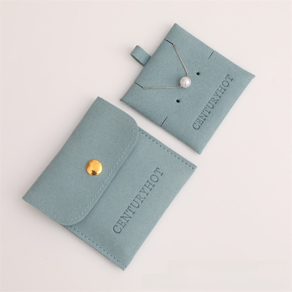 Two light blue jewelry pouches with a necklace on a white background