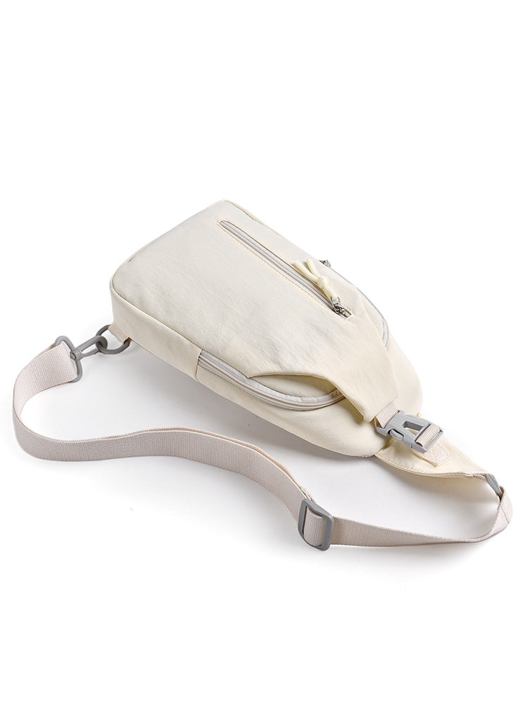 Beige crossbody bag on a white background