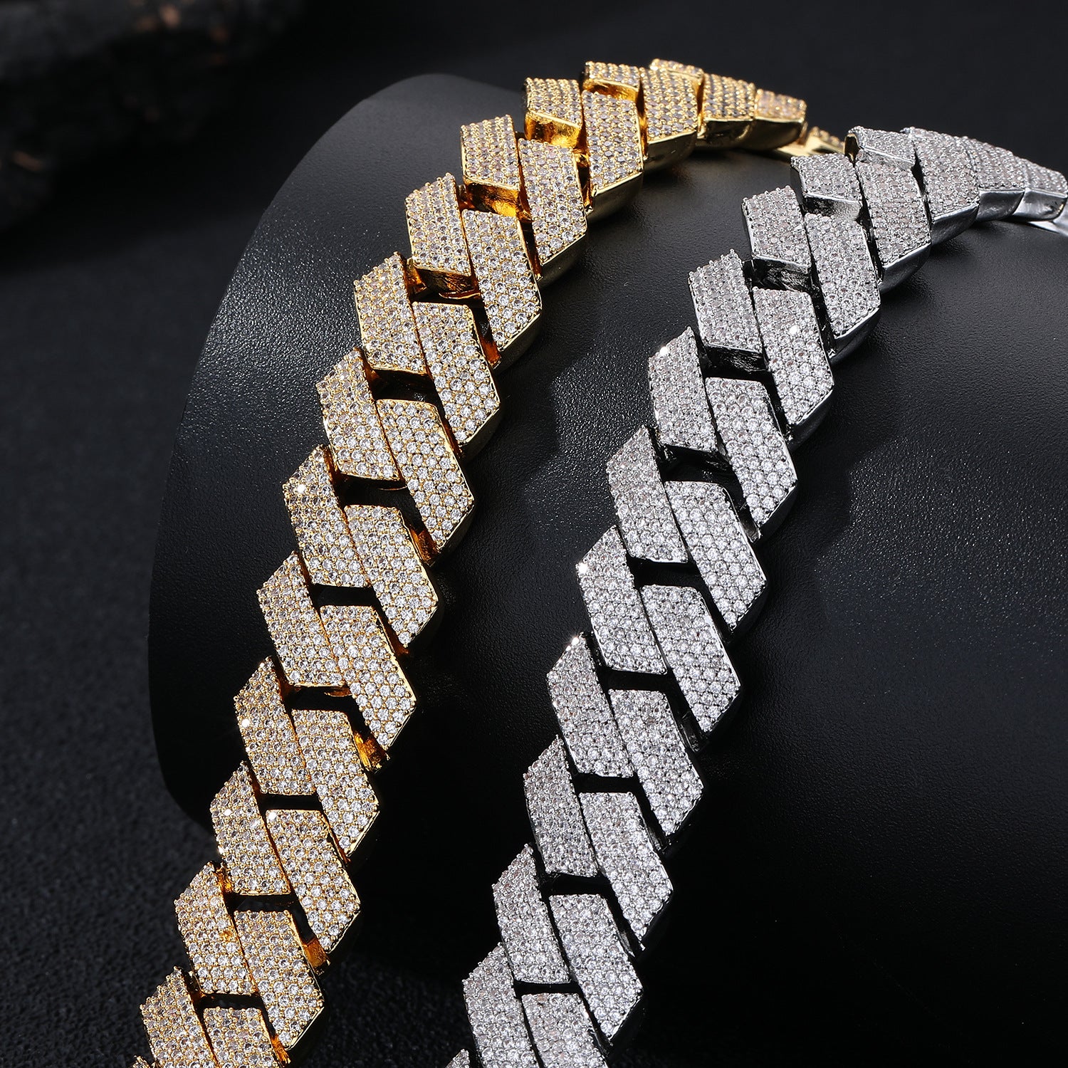 Gold and silver chain necklaces on a black background