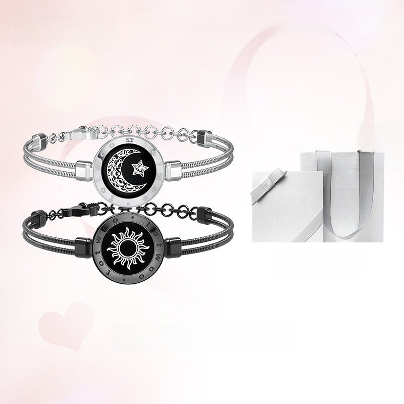 Two bracelets with sun and moon designs on a white background