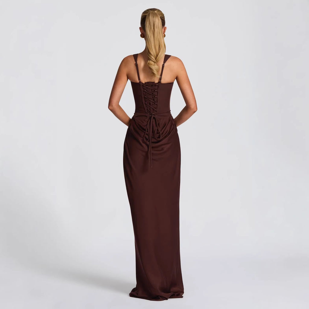 Woman wearing a brown evening gown on a white background