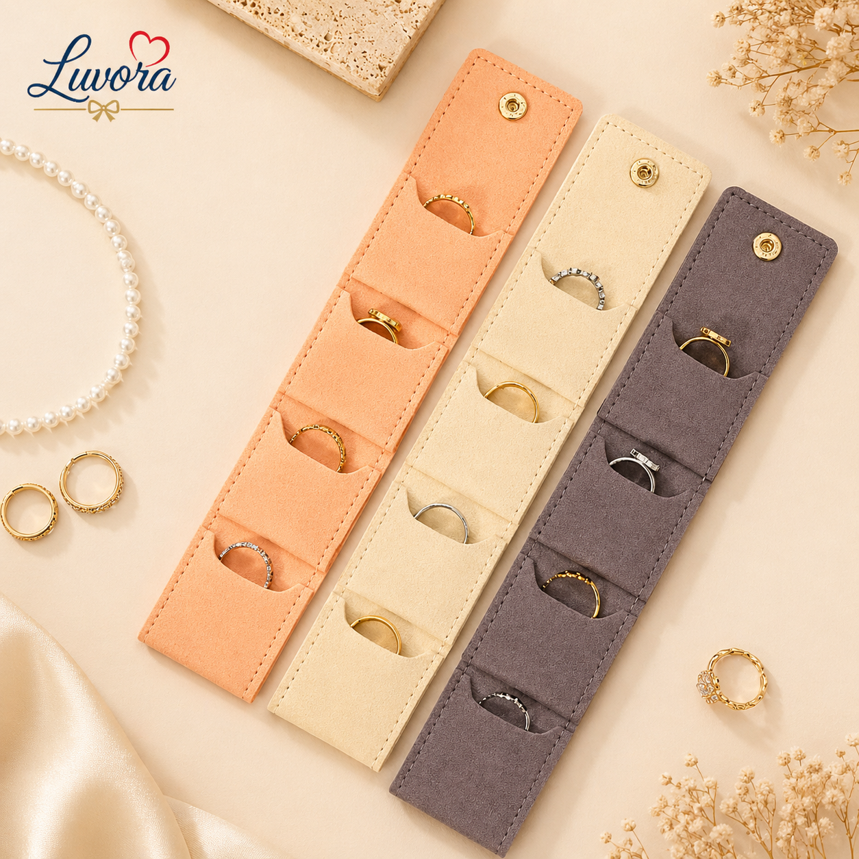 Portable jewelry storage bag for travel with multiple compartments for rings, earrings, necklaces, and bracelets in elegant minimalist beige and pink design.