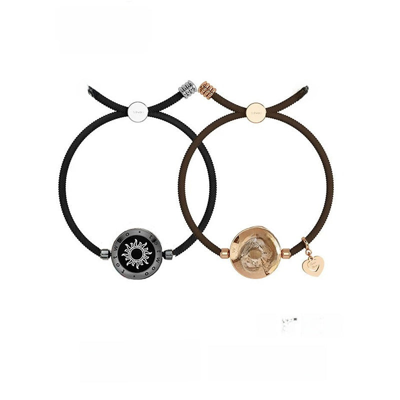 Two bracelets with decorative ends on a white background