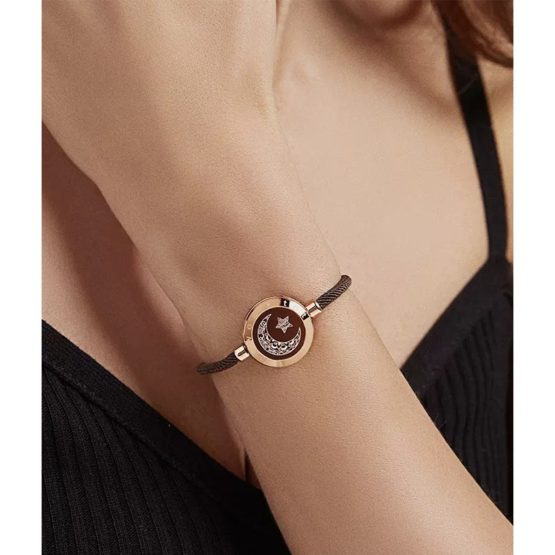 Bracelet with a circular design worn on a wrist against a neutral background
