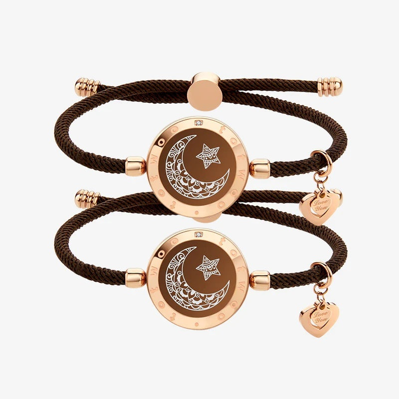 Two brown braided bracelets with rose gold circular charms and heart-shaped pendants on a white background.