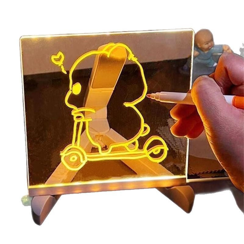 Hand holding a pen over a transparent board with a yellow 3D design of a scooter.