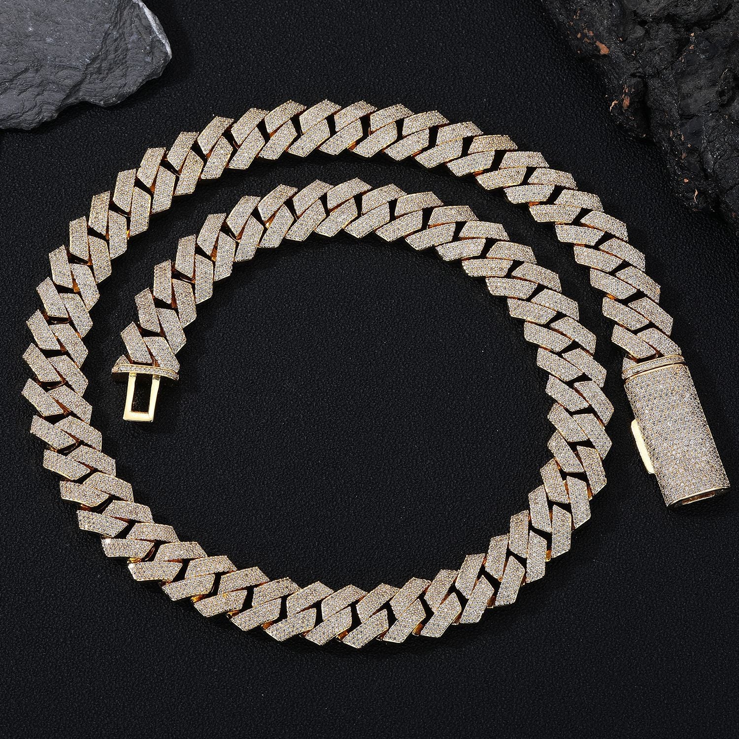 Gold chain bracelet on a black background